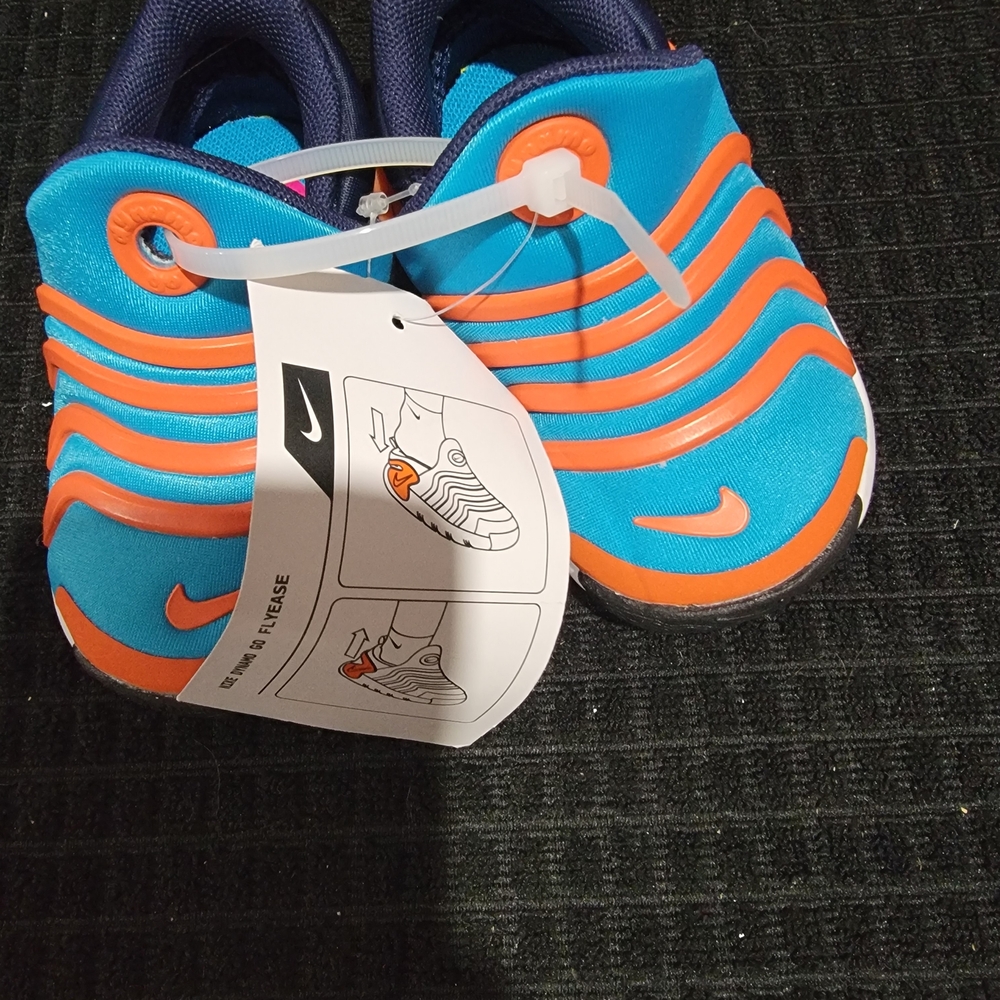 Nike Kids Slip-On Sneakers in Bright Blue with Orange Accents